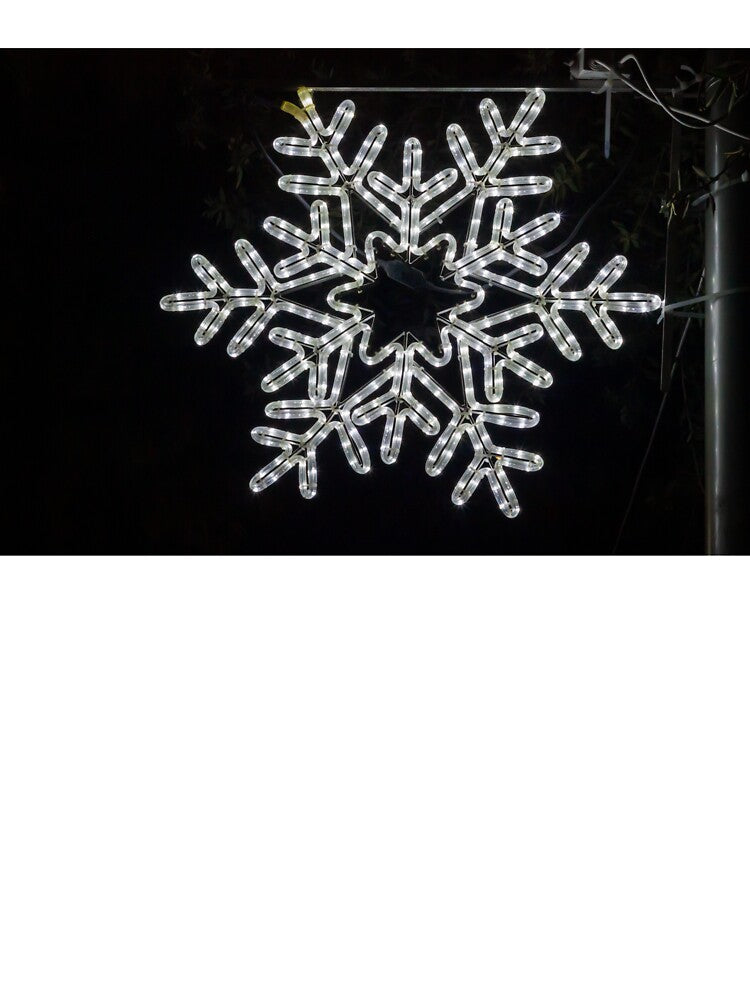Illuminated Snowflake Holiday Light Decoration Hanging On Pole Against Dark Night Sky by Nmallia