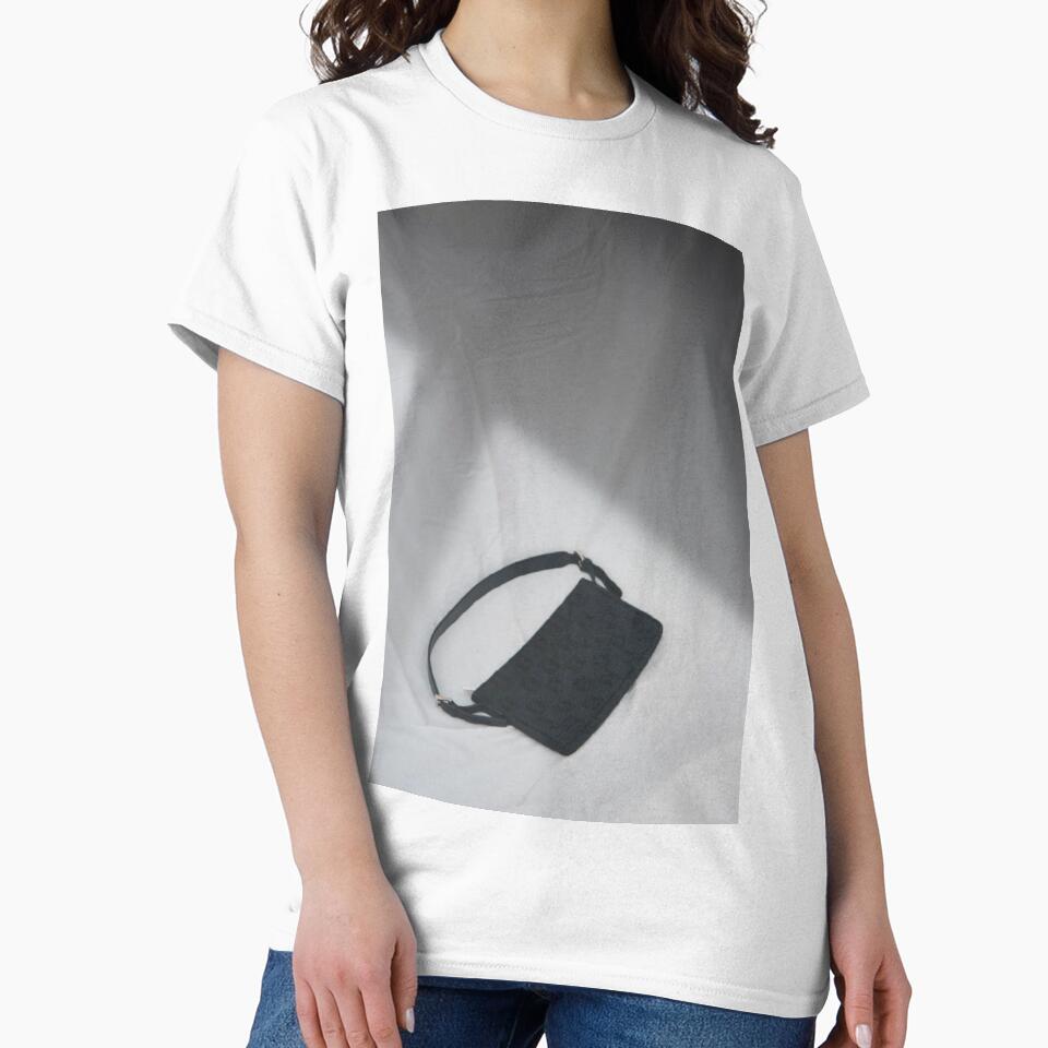 Black handbag on white background by julidescole